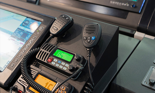 Marine navigation system display with VHF radio and communication devices.