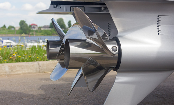 Marine propulsion system with stainless steel propellers near a marina.